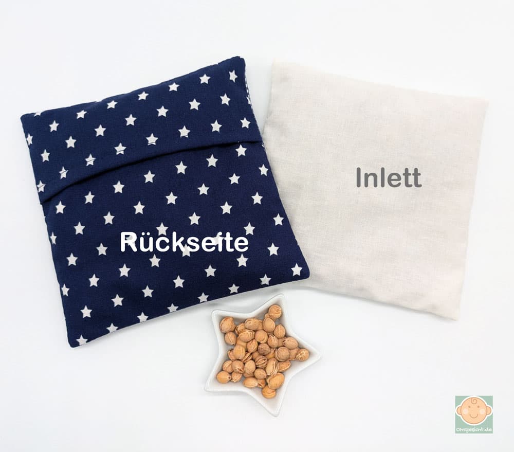Wärmekissen mit Sternen und herausnehmbarem Inlett.